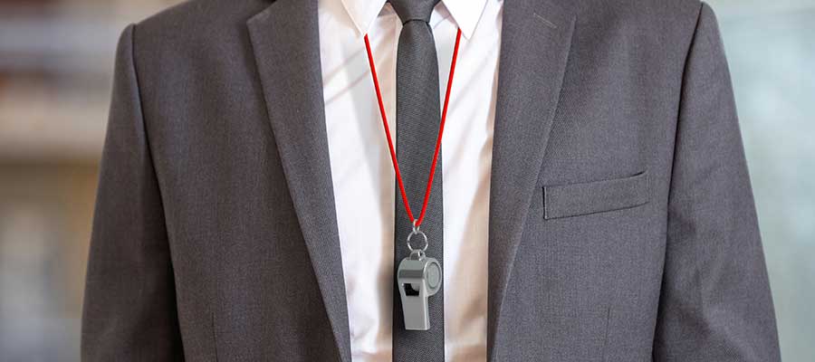 business coach wearing a whistle