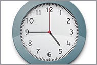 An analog clock that reads five forty-five 