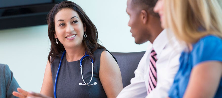 woman doctor meeting with board