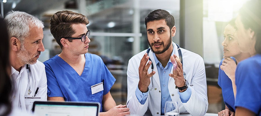 doctor leading a team meeting