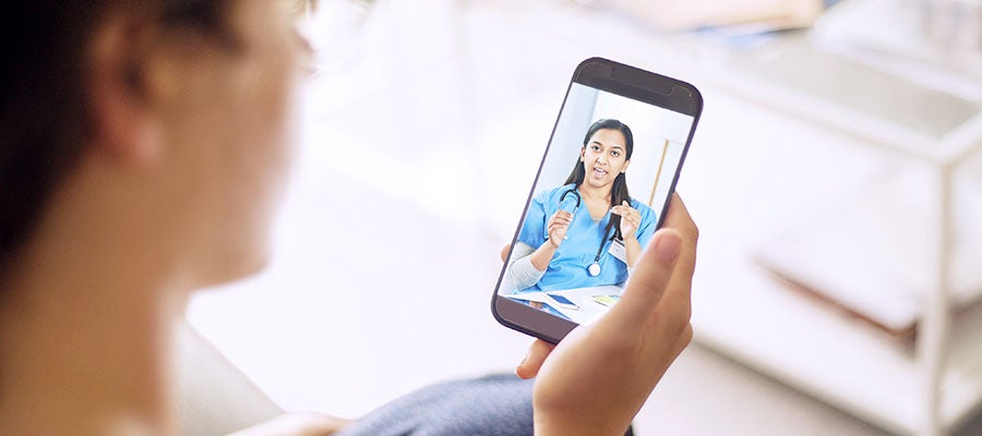 telehealth woman talking to nurse on smartphone