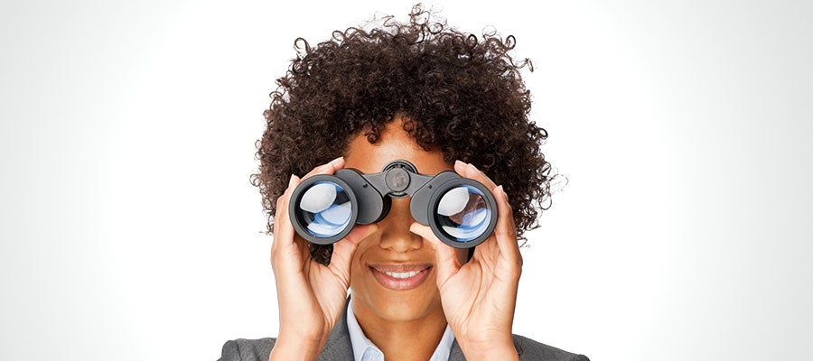 woman looking through binoculars