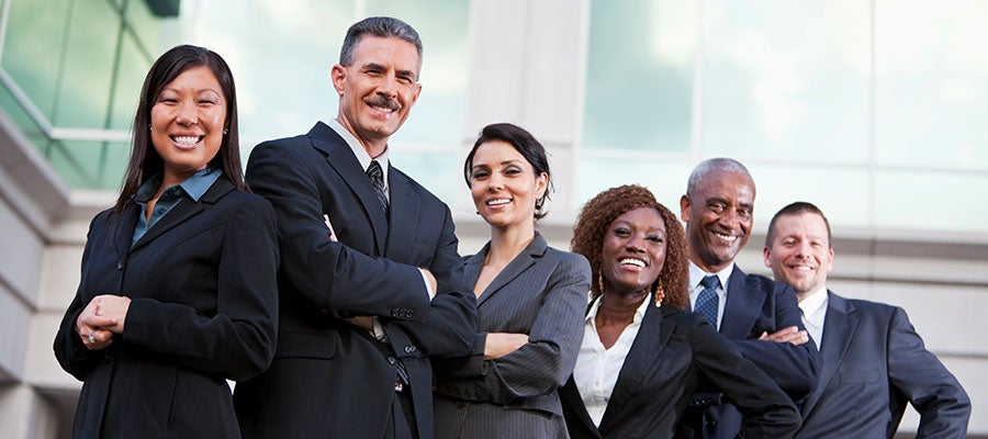 diverse business people smiling at camera