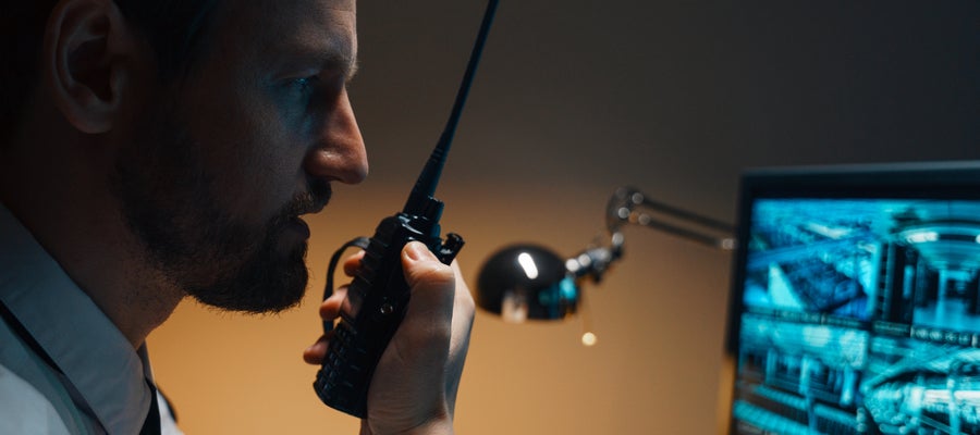 security guard on walkie talkie