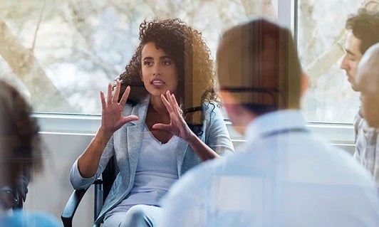 Woman facilitating a business meeting