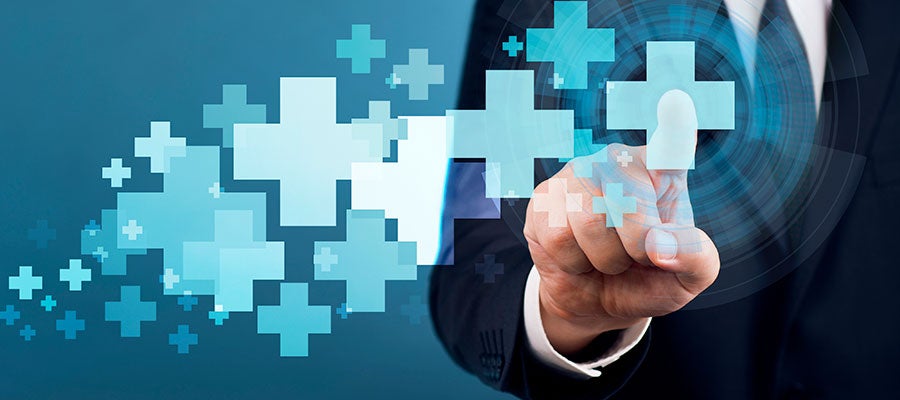 photo illustration of a business man pointing at digital medical crosses