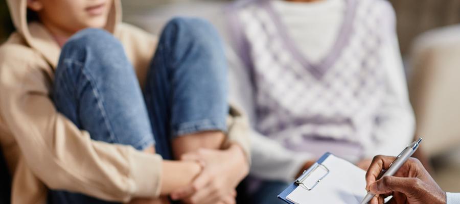 girls in chair holding her legs